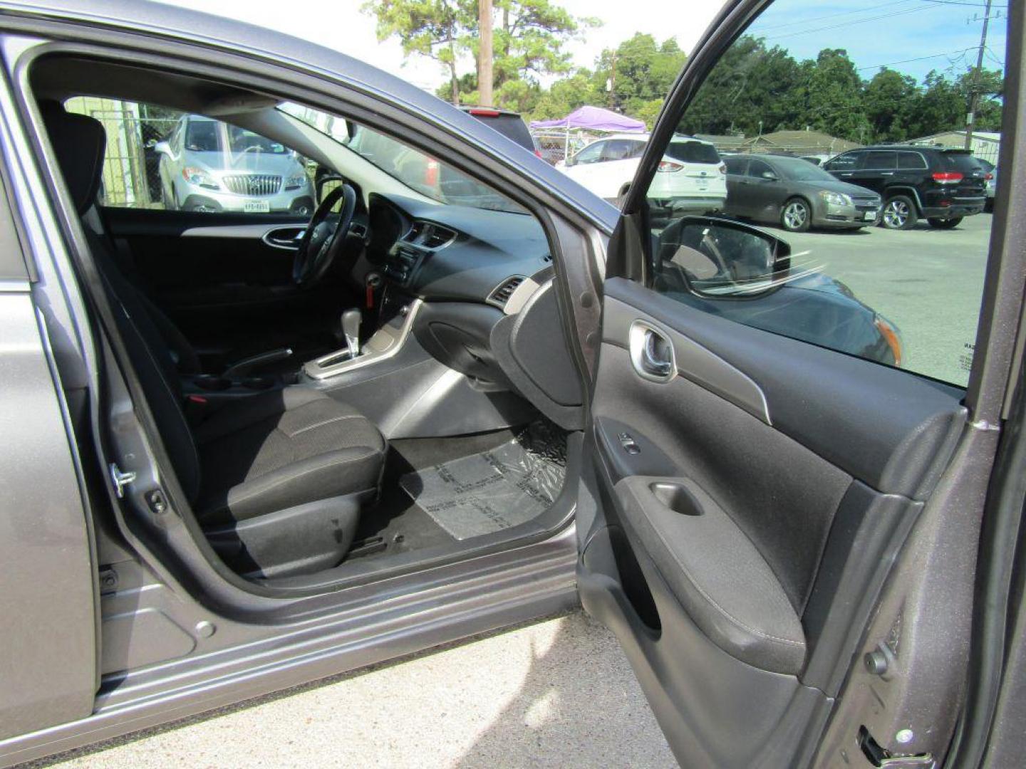 2015 GRAY NISSAN SENTRA S (3N1AB7AP5FY) with an 1.8L engine, Continuously Variable transmission, located at 830 E. Canino Rd., Houston, TX, 77037, (281) 405-0440, 38.358219, -81.729942 - Photo#14