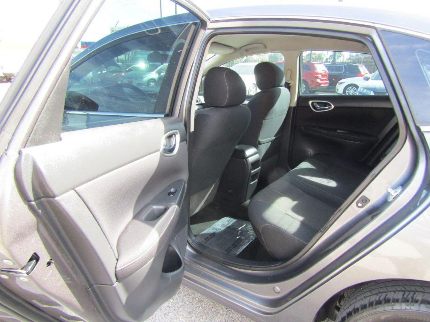 2015 GRAY NISSAN SENTRA S (3N1AB7AP5FY) with an 1.8L engine, Continuously Variable transmission, located at 830 E. Canino Rd., Houston, TX, 77037, (281) 405-0440, 38.358219, -81.729942 - Photo#7