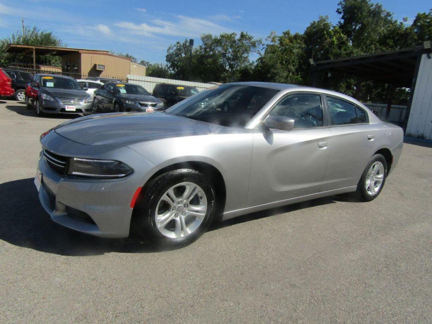 2015 SILVER DODGE CHARGER SE (2C3CDXBG3FH) with an 3.6L engine, Automatic transmission, located at 830 E. Canino Rd., Houston, TX, 77037, (281) 405-0440, 38.358219, -81.729942 - Photo#0