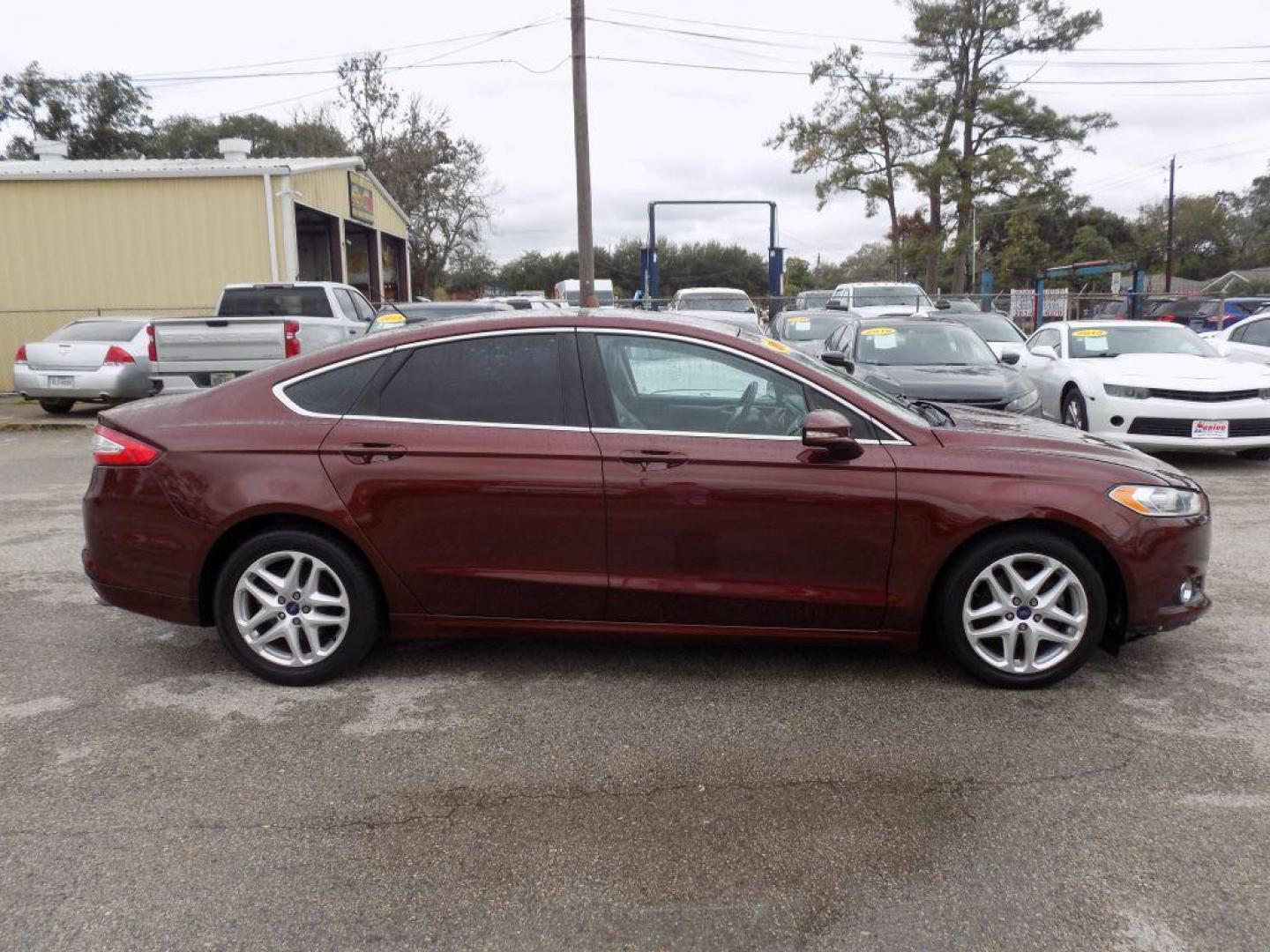 2016 BROWN FORD FUSION SE (3FA6P0HD6GR) with an 1.5L engine, Automatic transmission, located at 830 E. Canino Rd., Houston, TX, 77037, (281) 405-0440, 38.358219, -81.729942 - Photo#1