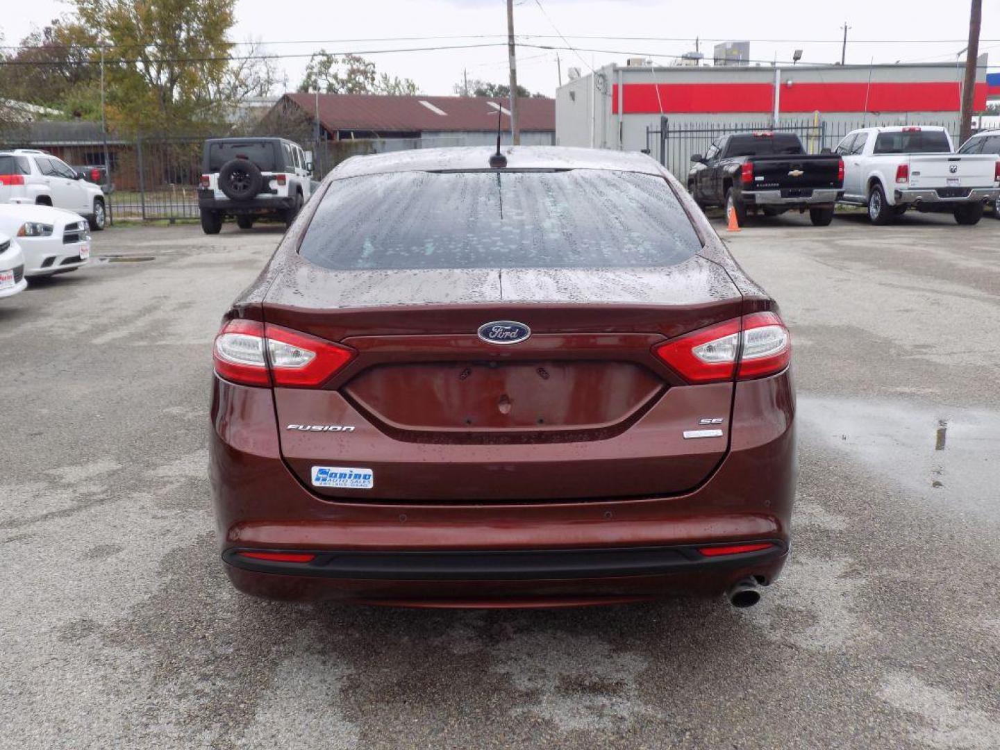 2016 BROWN FORD FUSION SE (3FA6P0HD6GR) with an 1.5L engine, Automatic transmission, located at 830 E. Canino Rd., Houston, TX, 77037, (281) 405-0440, 38.358219, -81.729942 - Photo#2