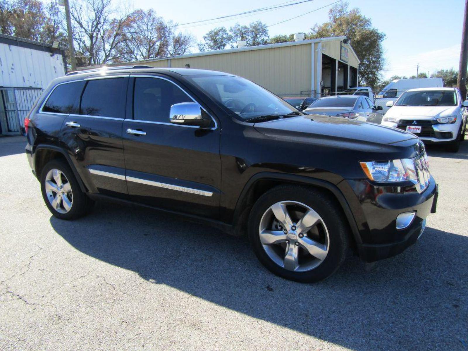 2012 BROWN JEEP GRAND CHEROKEE OVERLAND (1C4RJFCT7CC) with an 5.7L engine, Automatic transmission, located at 830 E. Canino Rd., Houston, TX, 77037, (281) 405-0440, 38.358219, -81.729942 - Photo #1