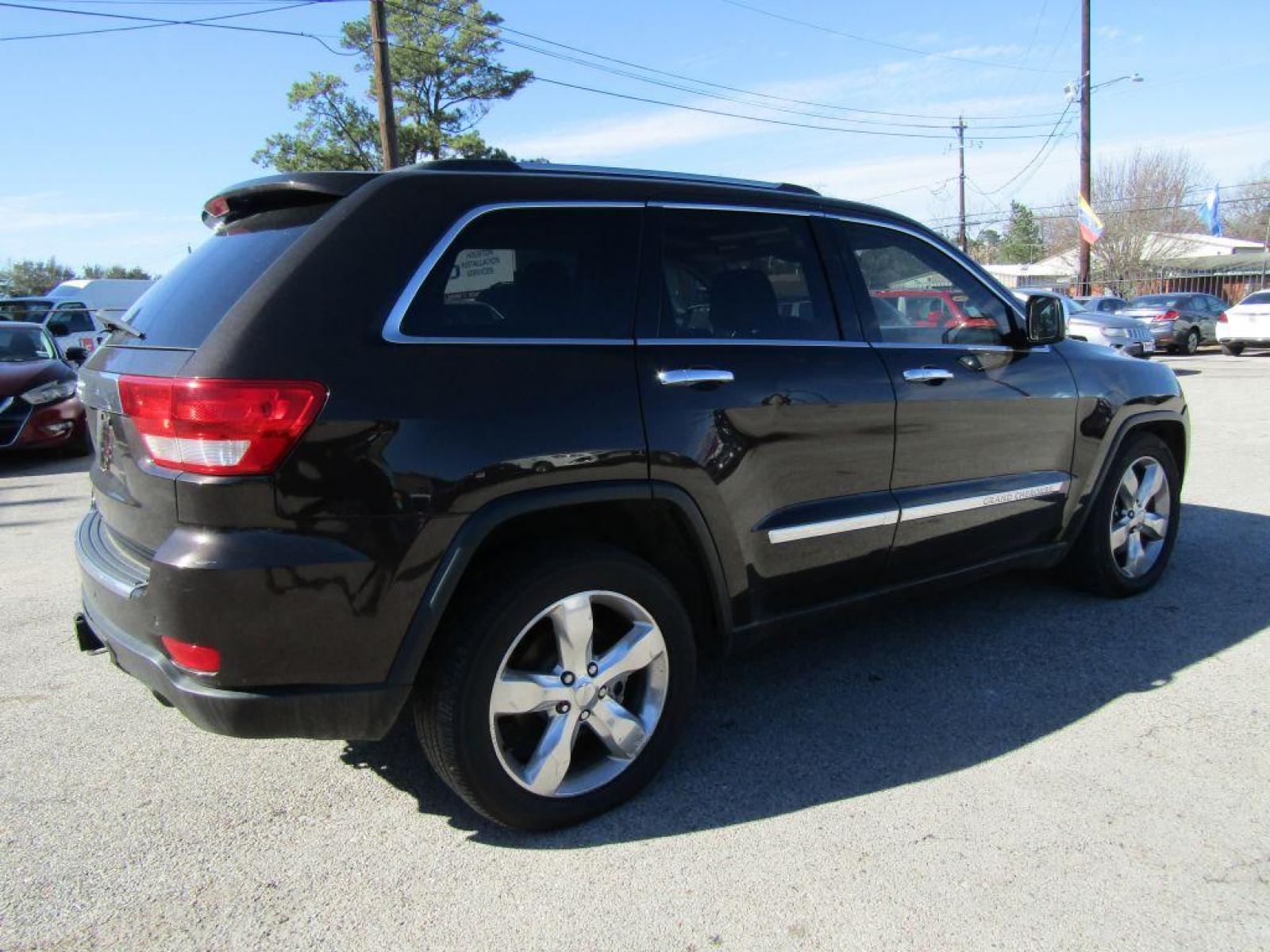 2012 BROWN JEEP GRAND CHEROKEE OVERLAND (1C4RJFCT7CC) with an 5.7L engine, Automatic transmission, located at 830 E. Canino Rd., Houston, TX, 77037, (281) 405-0440, 38.358219, -81.729942 - Photo #2