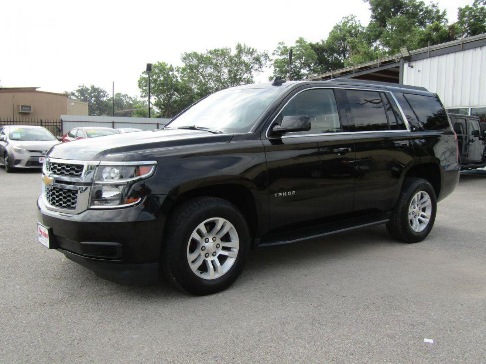 2019 BLACK CHEVROLET TAHOE 1500 LT (1GNSCBKC9KR) with an 5.3L engine, Automatic transmission, located at 830 E. Canino Rd., Houston, TX, 77037, (281) 405-0440, 38.358219, -81.729942 - Photo #1