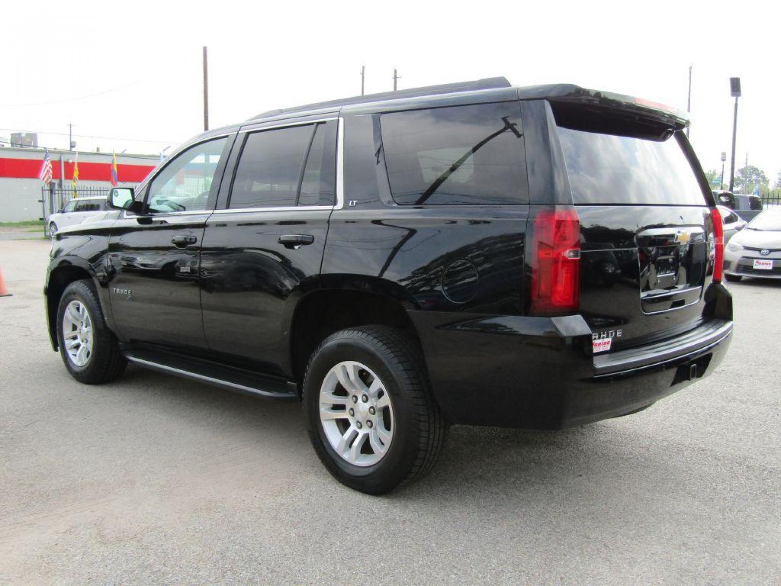 2019 BLACK CHEVROLET TAHOE 1500 LT (1GNSCBKC9KR) with an 5.3L engine, Automatic transmission, located at 830 E. Canino Rd., Houston, TX, 77037, (281) 405-0440, 38.358219, -81.729942 - Photo #2