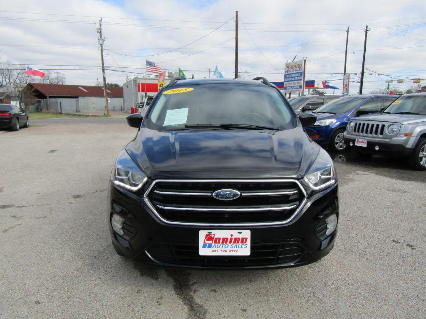 2018 BLACK FORD ESCAPE SE (1FMCU9GD2JU) with an 1.5L engine, Automatic transmission, located at 830 E. Canino Rd., Houston, TX, 77037, (281) 405-0440, 38.358219, -81.729942 - Photo#0