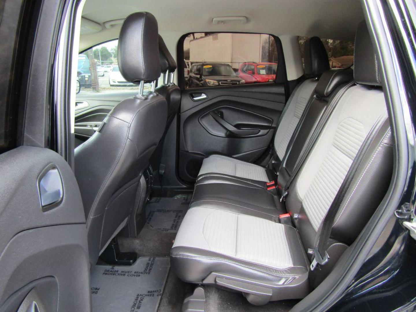2018 BLACK FORD ESCAPE SE (1FMCU9GD2JU) with an 1.5L engine, Automatic transmission, located at 830 E. Canino Rd., Houston, TX, 77037, (281) 405-0440, 38.358219, -81.729942 - Photo#12