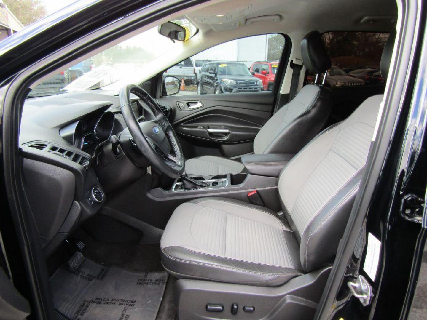 2018 BLACK FORD ESCAPE SE (1FMCU9GD2JU) with an 1.5L engine, Automatic transmission, located at 830 E. Canino Rd., Houston, TX, 77037, (281) 405-0440, 38.358219, -81.729942 - Photo#14