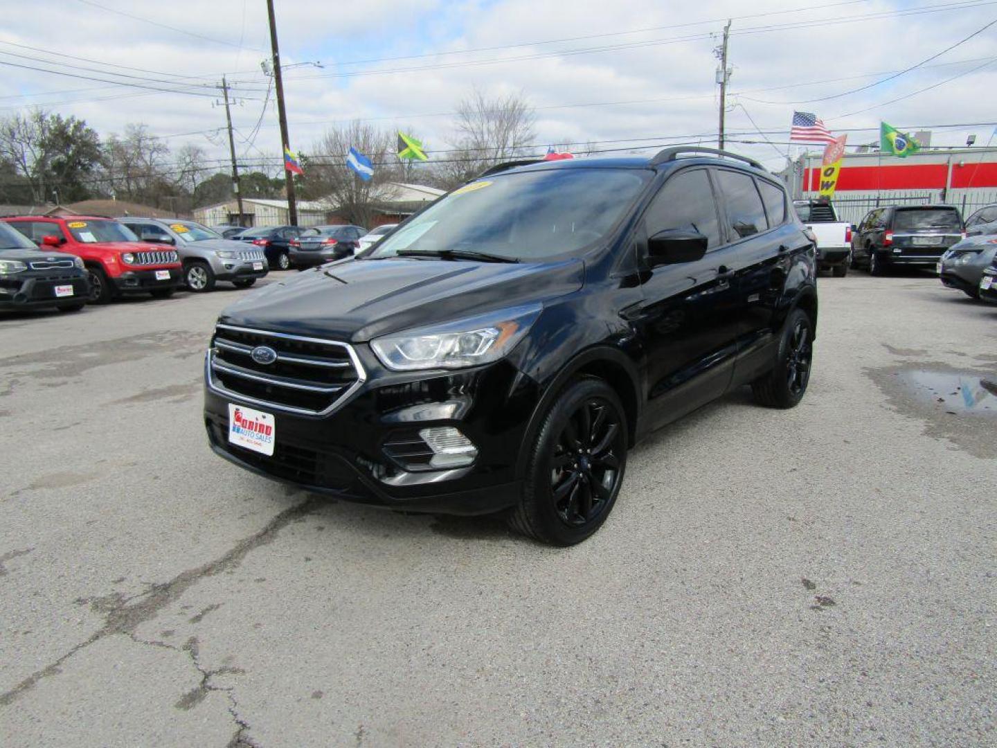 2018 BLACK FORD ESCAPE SE (1FMCU9GD2JU) with an 1.5L engine, Automatic transmission, located at 830 E. Canino Rd., Houston, TX, 77037, (281) 405-0440, 38.358219, -81.729942 - Photo#1