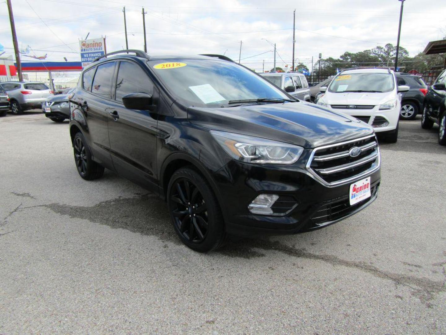 2018 BLACK FORD ESCAPE SE (1FMCU9GD2JU) with an 1.5L engine, Automatic transmission, located at 830 E. Canino Rd., Houston, TX, 77037, (281) 405-0440, 38.358219, -81.729942 - Photo#5