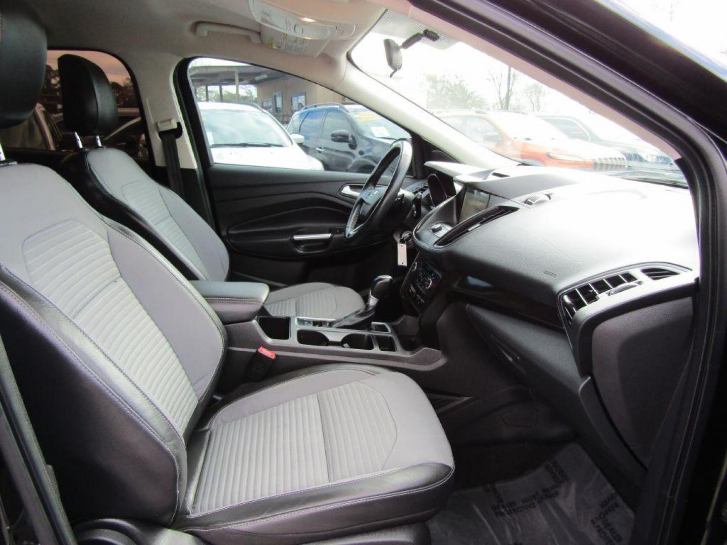 2018 BLACK FORD ESCAPE SE (1FMCU9GD2JU) with an 1.5L engine, Automatic transmission, located at 830 E. Canino Rd., Houston, TX, 77037, (281) 405-0440, 38.358219, -81.729942 - Photo#7
