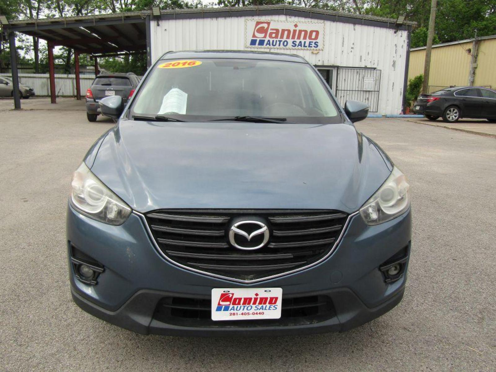 2016 BLUE MAZDA CX-5 TOURING (JM3KE2CY9G0) with an 2.5L engine, Automatic transmission, located at 830 E. Canino Rd., Houston, TX, 77037, (281) 405-0440, 38.358219, -81.729942 - Photo #0