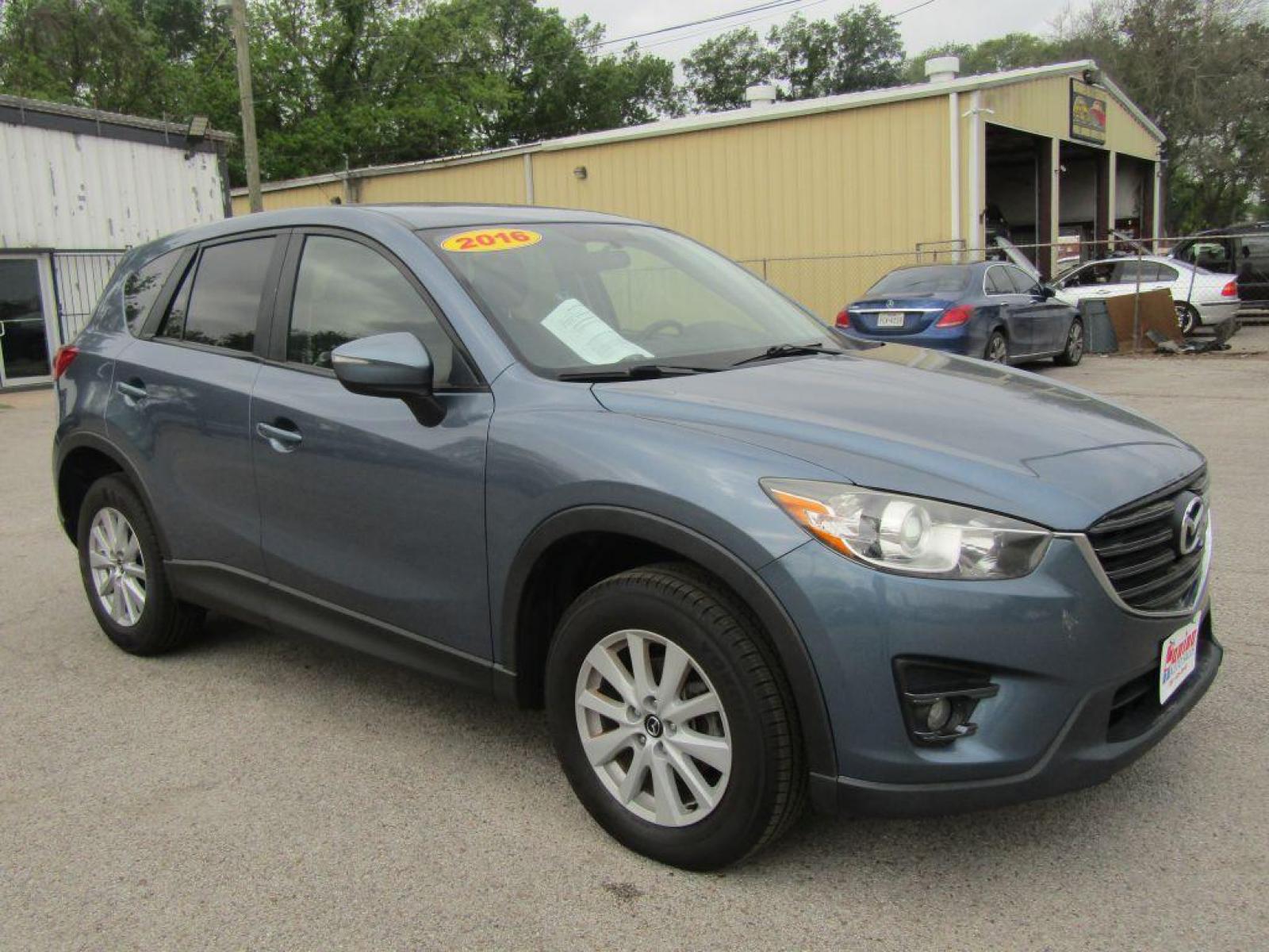 2016 BLUE MAZDA CX-5 TOURING (JM3KE2CY9G0) with an 2.5L engine, Automatic transmission, located at 830 E. Canino Rd., Houston, TX, 77037, (281) 405-0440, 38.358219, -81.729942 - Photo #1