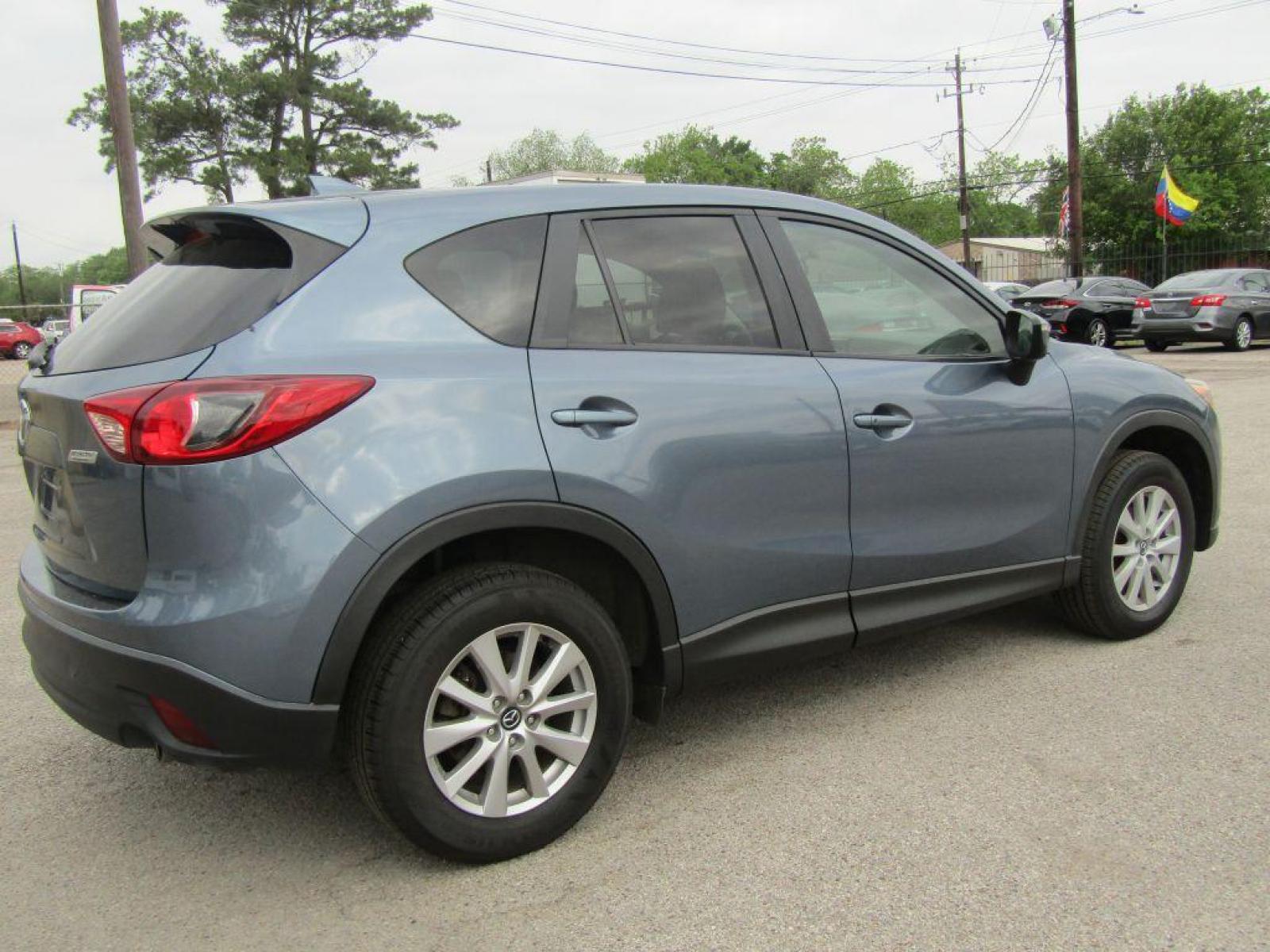 2016 BLUE MAZDA CX-5 TOURING (JM3KE2CY9G0) with an 2.5L engine, Automatic transmission, located at 830 E. Canino Rd., Houston, TX, 77037, (281) 405-0440, 38.358219, -81.729942 - Photo #2