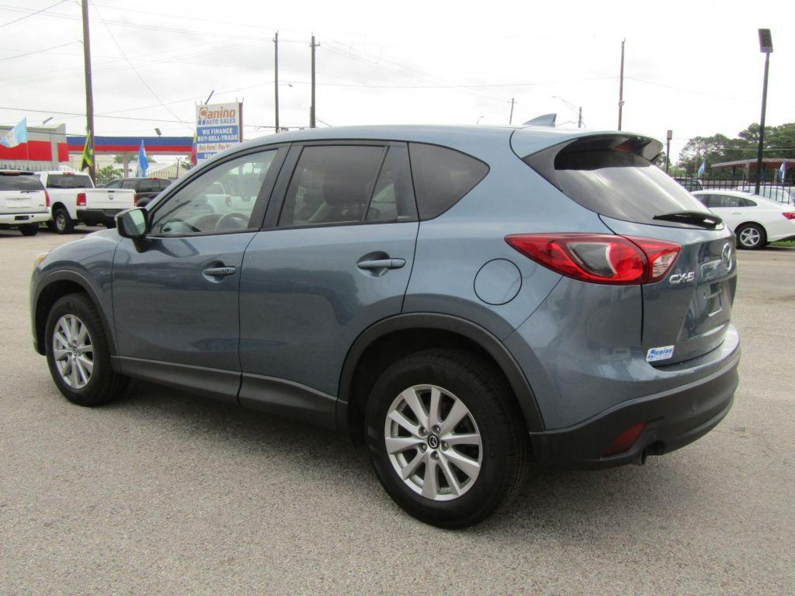 2016 BLUE MAZDA CX-5 TOURING (JM3KE2CY9G0) with an 2.5L engine, Automatic transmission, located at 830 E. Canino Rd., Houston, TX, 77037, (281) 405-0440, 38.358219, -81.729942 - Photo #4