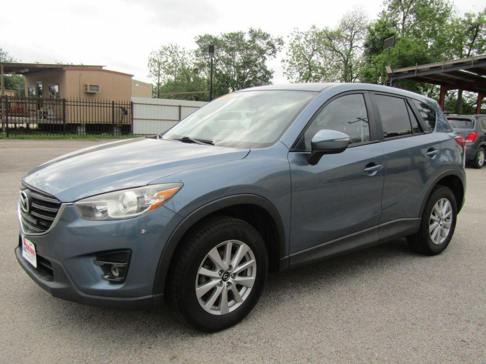 2016 BLUE MAZDA CX-5 TOURING (JM3KE2CY9G0) with an 2.5L engine, Automatic transmission, located at 830 E. Canino Rd., Houston, TX, 77037, (281) 405-0440, 38.358219, -81.729942 - Photo #5