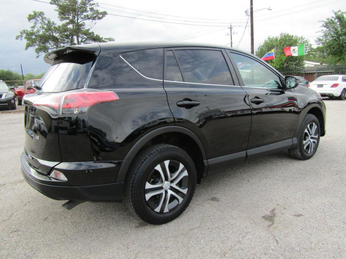 2017 BLACK TOYOTA RAV4 LE (2T3ZFREV5HW) with an 2.5L engine, Automatic transmission, located at 830 E. Canino Rd., Houston, TX, 77037, (281) 405-0440, 38.358219, -81.729942 - Photo#2