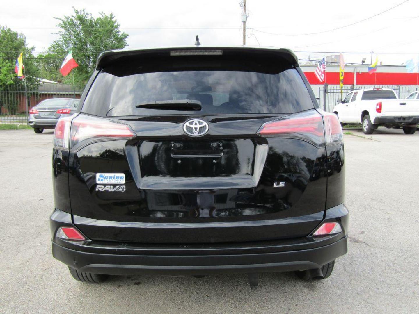 2017 BLACK TOYOTA RAV4 LE (2T3ZFREV5HW) with an 2.5L engine, Automatic transmission, located at 830 E. Canino Rd., Houston, TX, 77037, (281) 405-0440, 38.358219, -81.729942 - Photo#3