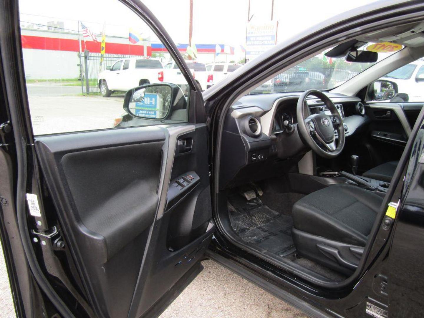 2017 BLACK TOYOTA RAV4 LE (2T3ZFREV5HW) with an 2.5L engine, Automatic transmission, located at 830 E. Canino Rd., Houston, TX, 77037, (281) 405-0440, 38.358219, -81.729942 - Photo#7