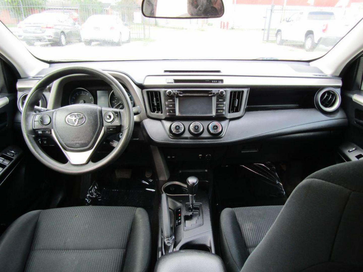 2017 BLACK TOYOTA RAV4 LE (2T3ZFREV5HW) with an 2.5L engine, Automatic transmission, located at 830 E. Canino Rd., Houston, TX, 77037, (281) 405-0440, 38.358219, -81.729942 - Photo#10