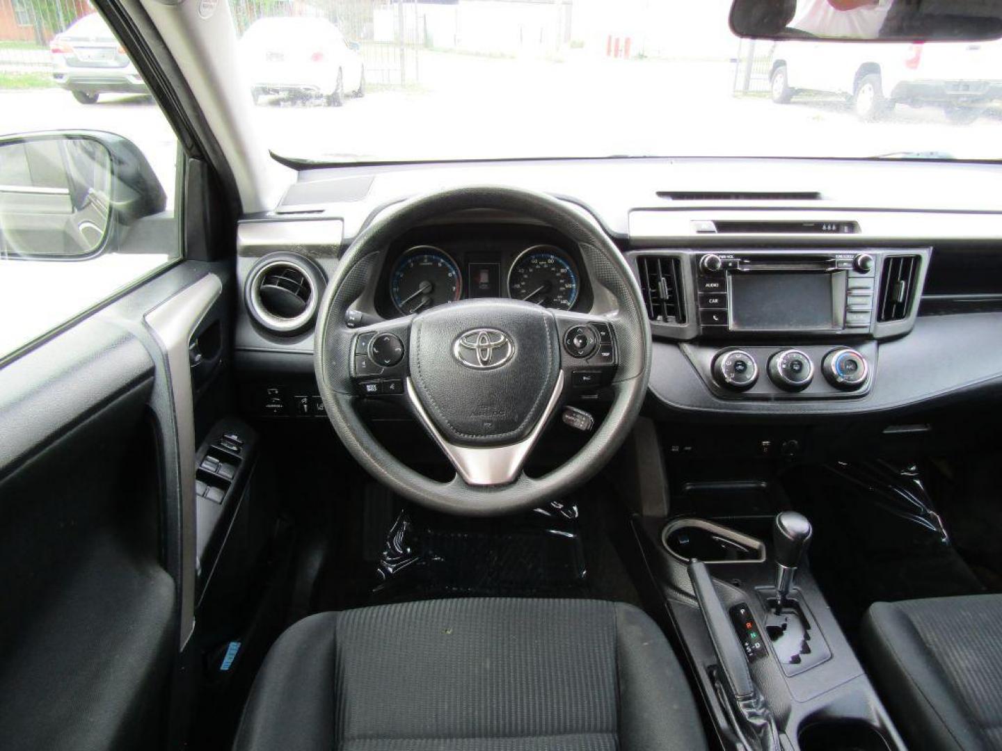 2017 BLACK TOYOTA RAV4 LE (2T3ZFREV5HW) with an 2.5L engine, Automatic transmission, located at 830 E. Canino Rd., Houston, TX, 77037, (281) 405-0440, 38.358219, -81.729942 - Photo#11