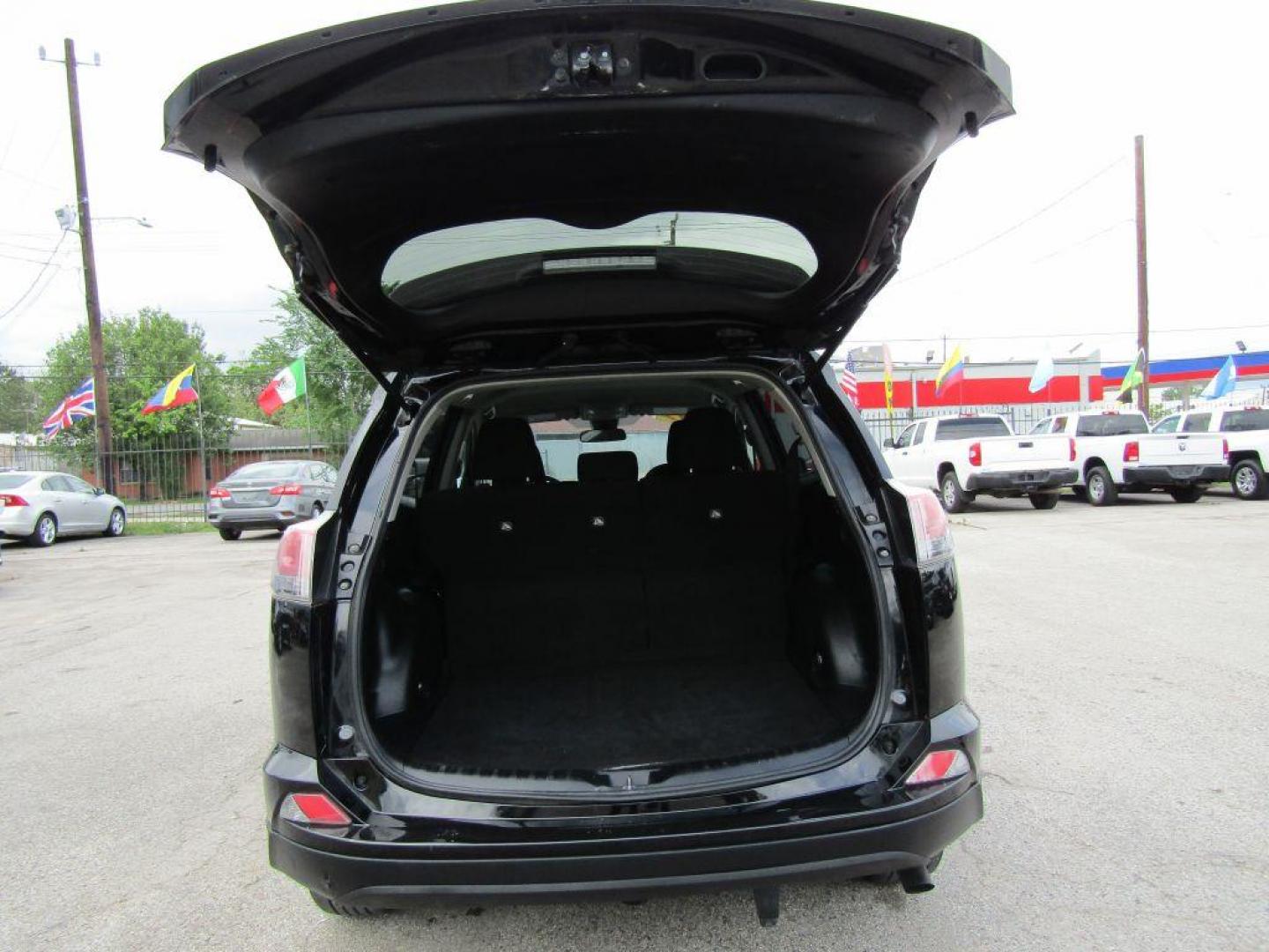 2017 BLACK TOYOTA RAV4 LE (2T3ZFREV5HW) with an 2.5L engine, Automatic transmission, located at 830 E. Canino Rd., Houston, TX, 77037, (281) 405-0440, 38.358219, -81.729942 - Photo#13