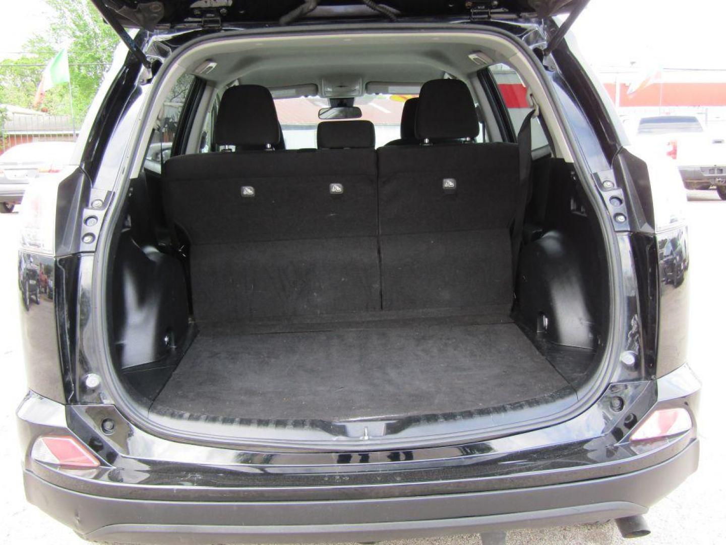 2017 BLACK TOYOTA RAV4 LE (2T3ZFREV5HW) with an 2.5L engine, Automatic transmission, located at 830 E. Canino Rd., Houston, TX, 77037, (281) 405-0440, 38.358219, -81.729942 - Photo#14