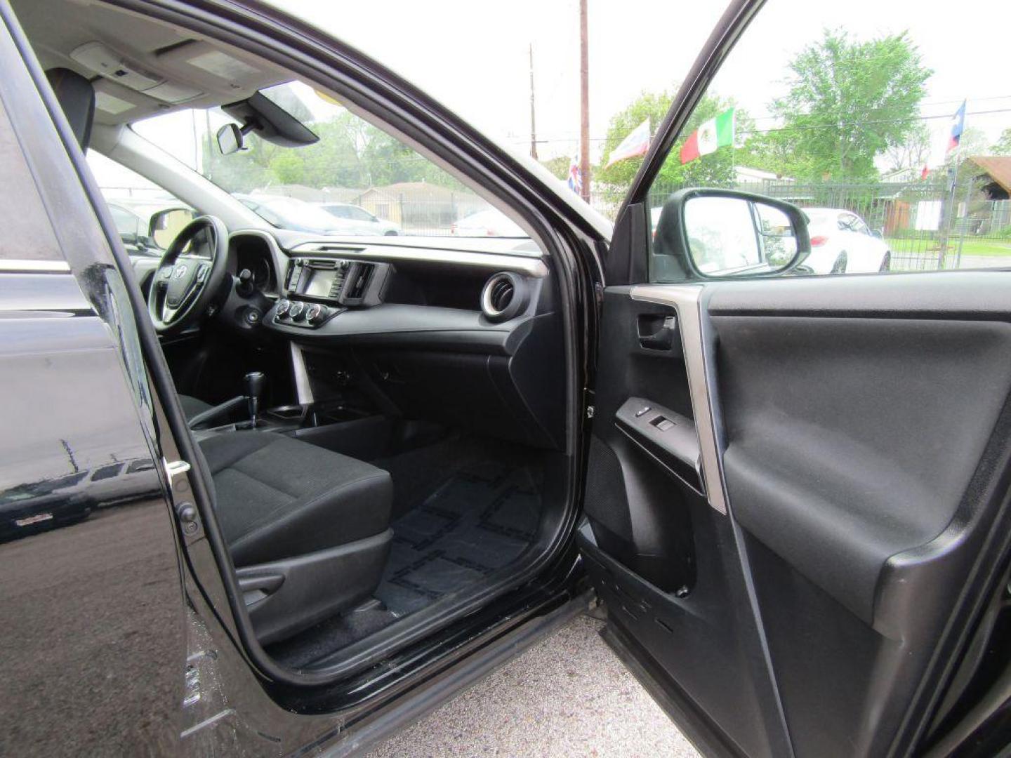 2017 BLACK TOYOTA RAV4 LE (2T3ZFREV5HW) with an 2.5L engine, Automatic transmission, located at 830 E. Canino Rd., Houston, TX, 77037, (281) 405-0440, 38.358219, -81.729942 - Photo#17