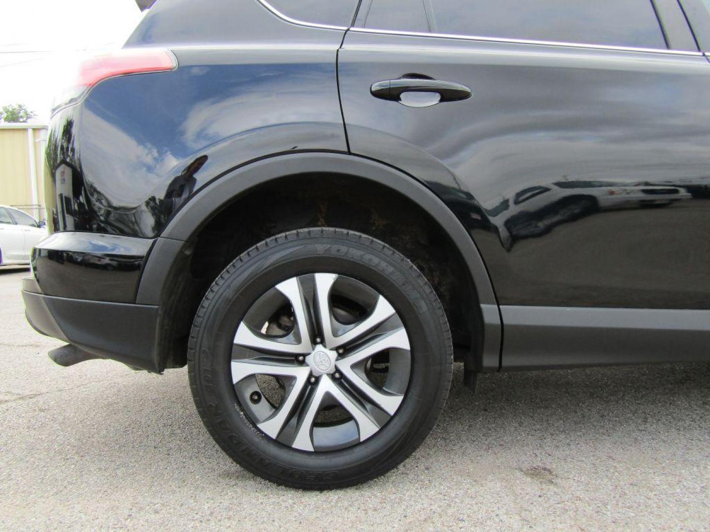 2017 BLACK TOYOTA RAV4 LE (2T3ZFREV5HW) with an 2.5L engine, Automatic transmission, located at 830 E. Canino Rd., Houston, TX, 77037, (281) 405-0440, 38.358219, -81.729942 - Photo#19