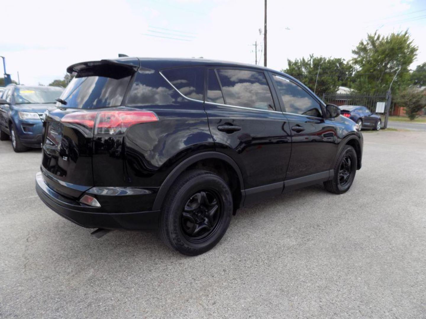 2017 BLACK TOYOTA RAV4 LE (2T3ZFREV5HW) with an 2.5L engine, Automatic transmission, located at 830 E. Canino Rd., Houston, TX, 77037, (281) 405-0440, 38.358219, -81.729942 - Photo#30