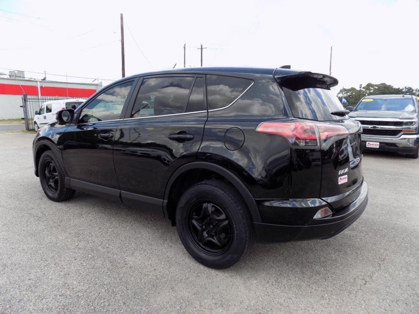 2017 BLACK TOYOTA RAV4 LE (2T3ZFREV5HW) with an 2.5L engine, Automatic transmission, located at 830 E. Canino Rd., Houston, TX, 77037, (281) 405-0440, 38.358219, -81.729942 - Photo#32