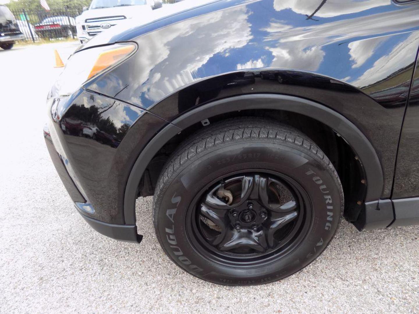 2017 BLACK TOYOTA RAV4 LE (2T3ZFREV5HW) with an 2.5L engine, Automatic transmission, located at 830 E. Canino Rd., Houston, TX, 77037, (281) 405-0440, 38.358219, -81.729942 - Photo#34