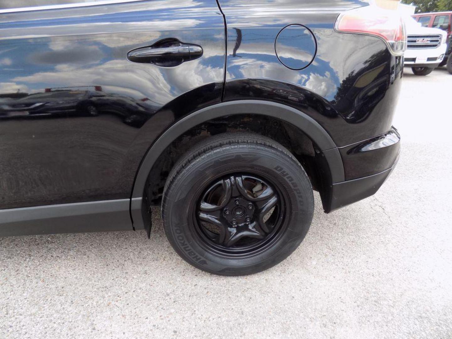 2017 BLACK TOYOTA RAV4 LE (2T3ZFREV5HW) with an 2.5L engine, Automatic transmission, located at 830 E. Canino Rd., Houston, TX, 77037, (281) 405-0440, 38.358219, -81.729942 - Photo#35