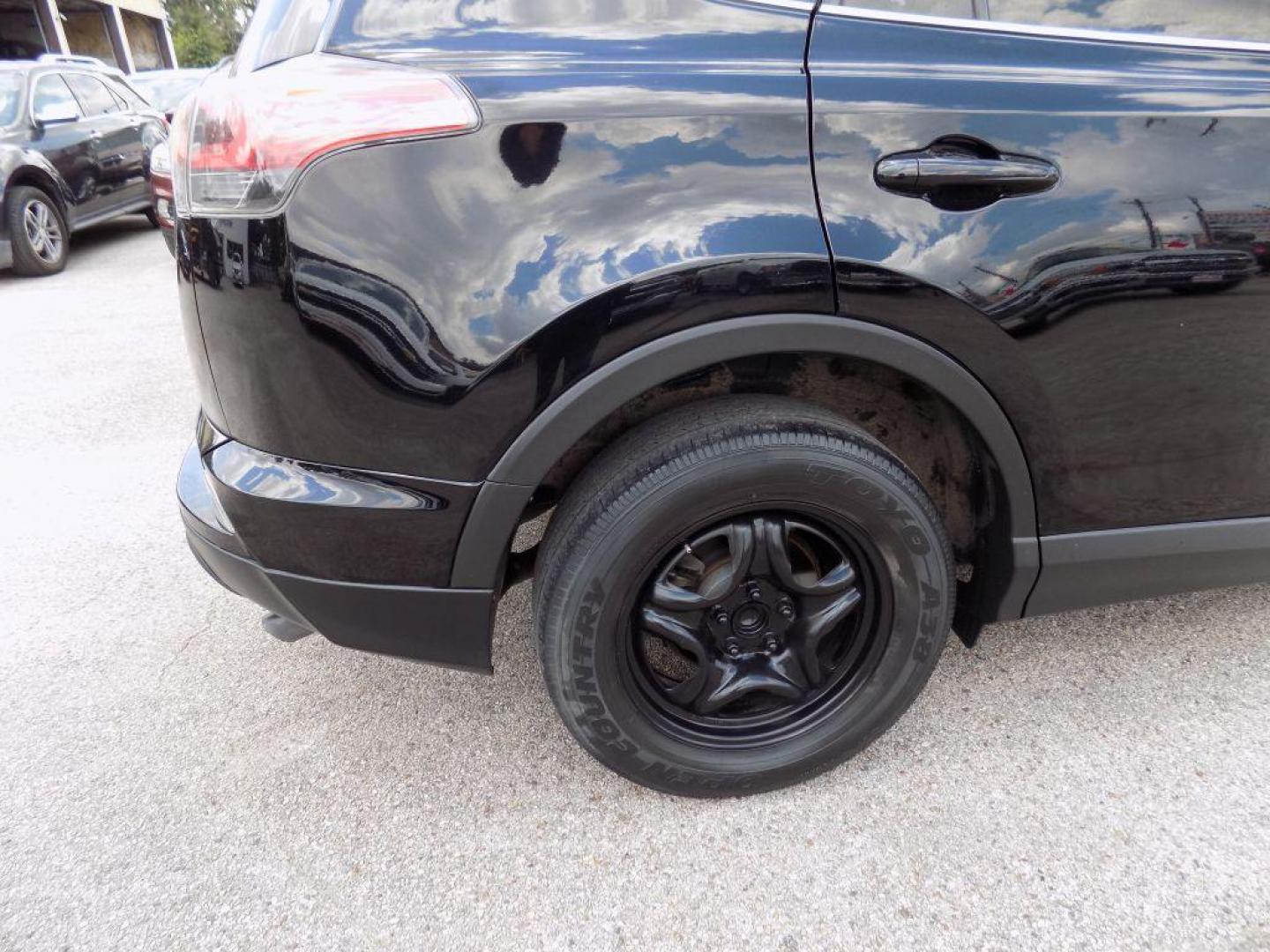 2017 BLACK TOYOTA RAV4 LE (2T3ZFREV5HW) with an 2.5L engine, Automatic transmission, located at 830 E. Canino Rd., Houston, TX, 77037, (281) 405-0440, 38.358219, -81.729942 - Photo#36