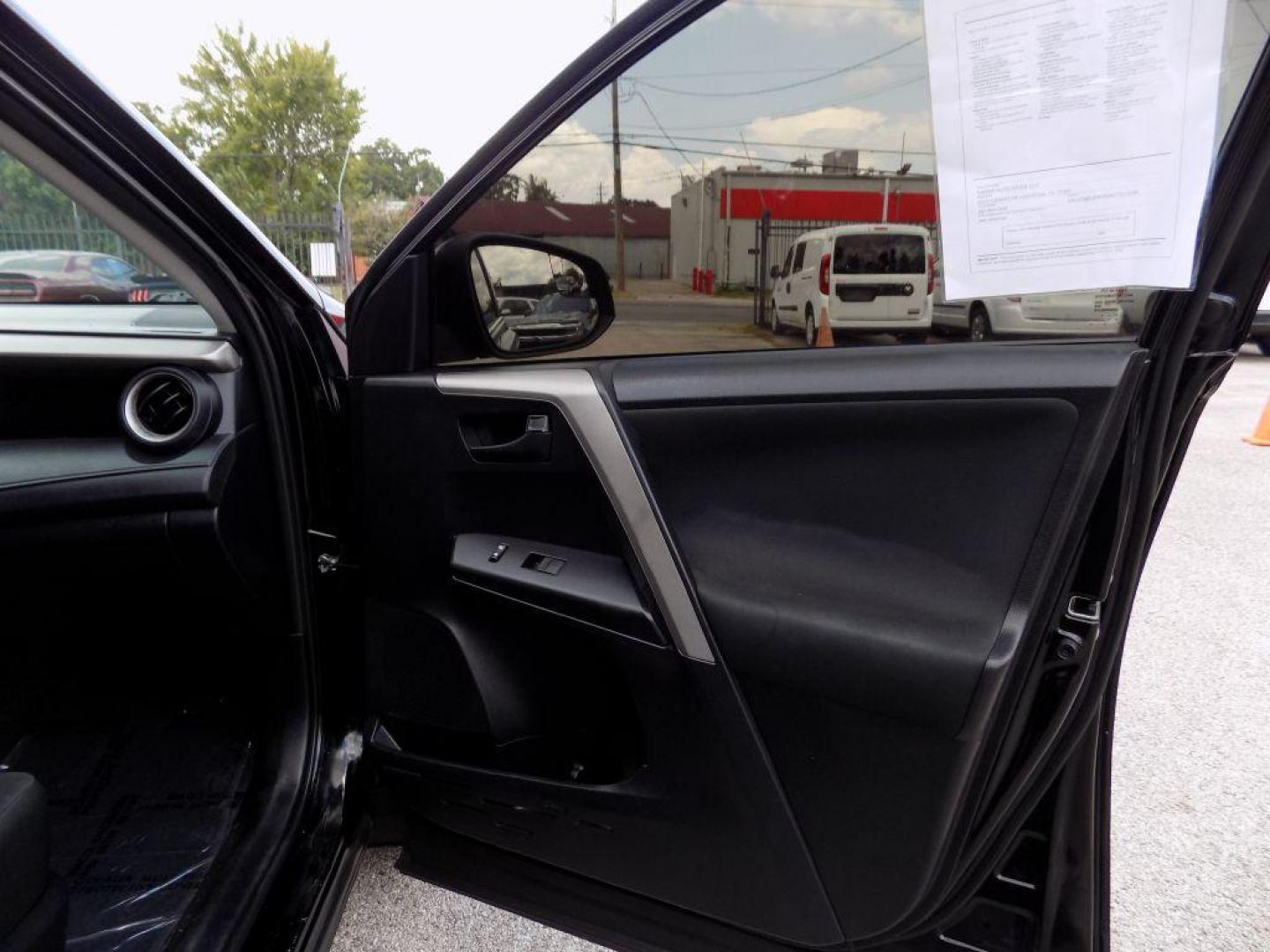 2017 BLACK TOYOTA RAV4 LE (2T3ZFREV5HW) with an 2.5L engine, Automatic transmission, located at 830 E. Canino Rd., Houston, TX, 77037, (281) 405-0440, 38.358219, -81.729942 - Photo#40