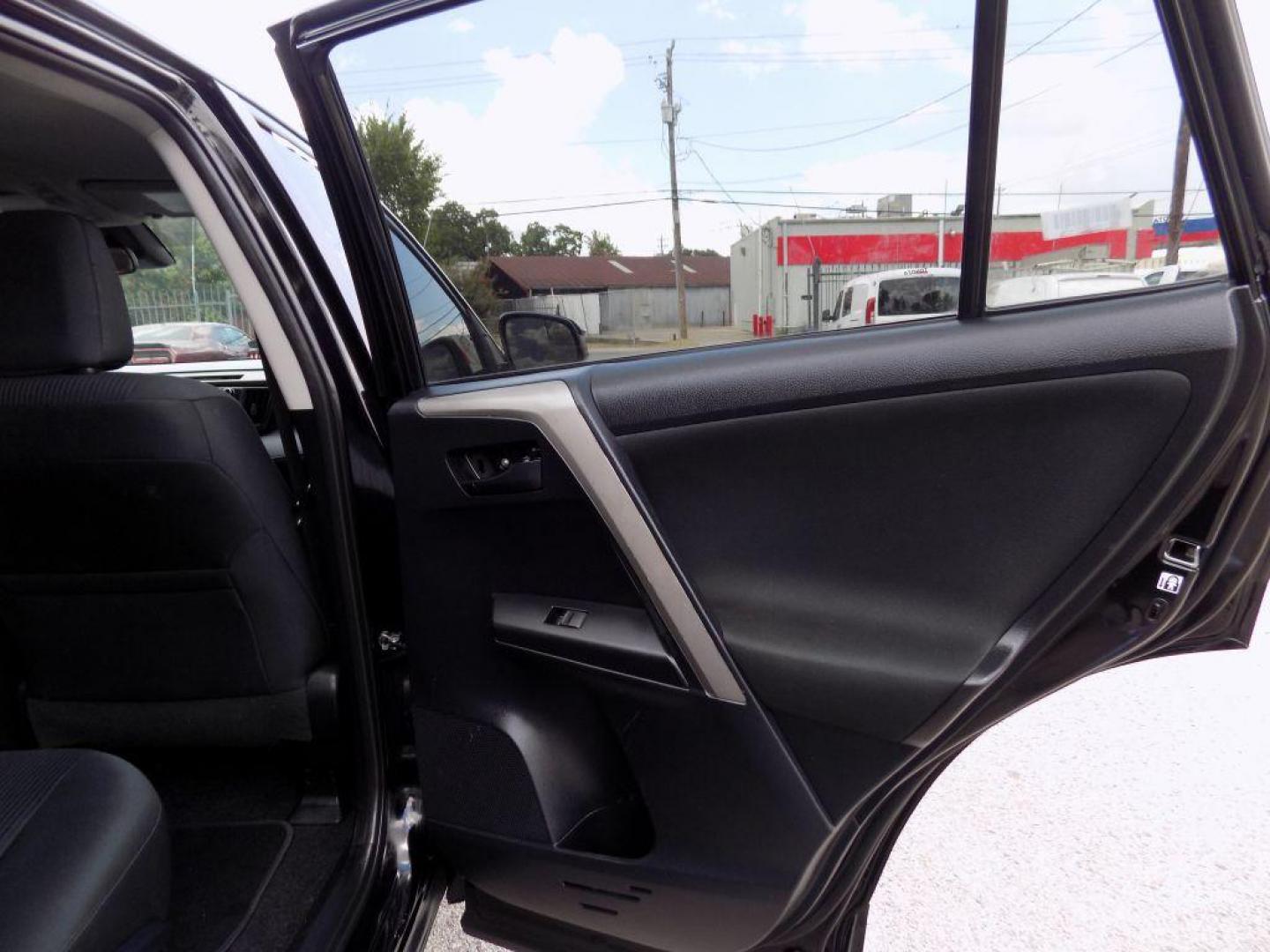 2017 BLACK TOYOTA RAV4 LE (2T3ZFREV5HW) with an 2.5L engine, Automatic transmission, located at 830 E. Canino Rd., Houston, TX, 77037, (281) 405-0440, 38.358219, -81.729942 - Photo#43