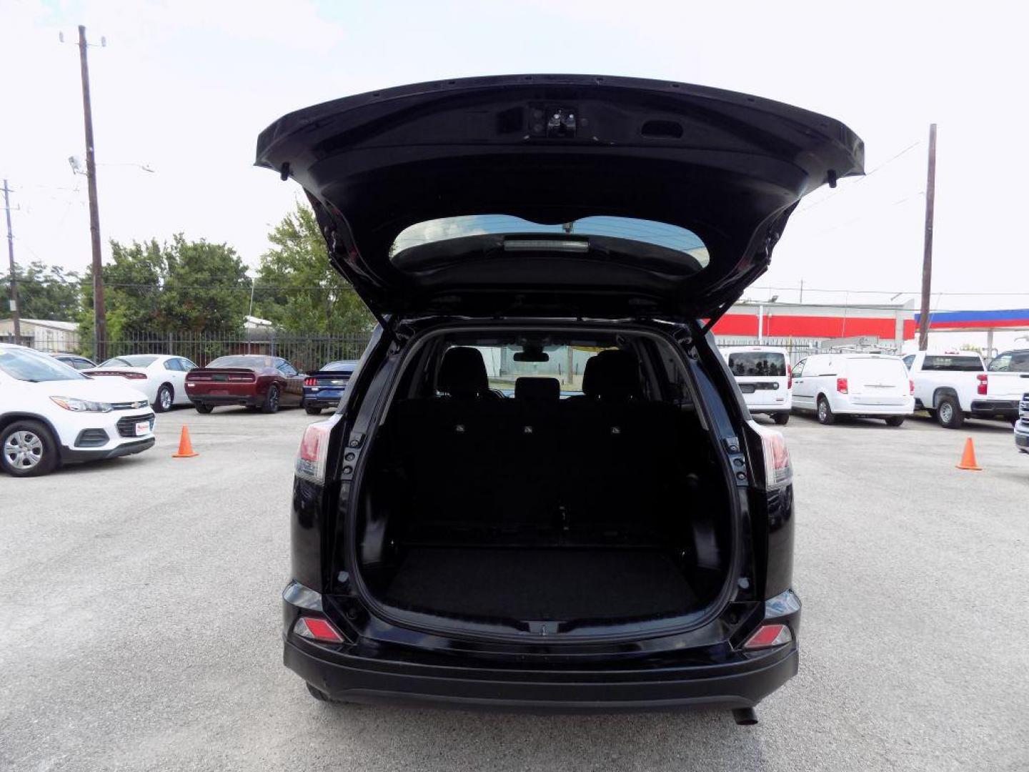 2017 BLACK TOYOTA RAV4 LE (2T3ZFREV5HW) with an 2.5L engine, Automatic transmission, located at 830 E. Canino Rd., Houston, TX, 77037, (281) 405-0440, 38.358219, -81.729942 - Photo#44