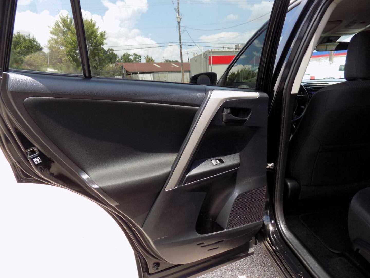 2017 BLACK TOYOTA RAV4 LE (2T3ZFREV5HW) with an 2.5L engine, Automatic transmission, located at 830 E. Canino Rd., Houston, TX, 77037, (281) 405-0440, 38.358219, -81.729942 - Photo#49