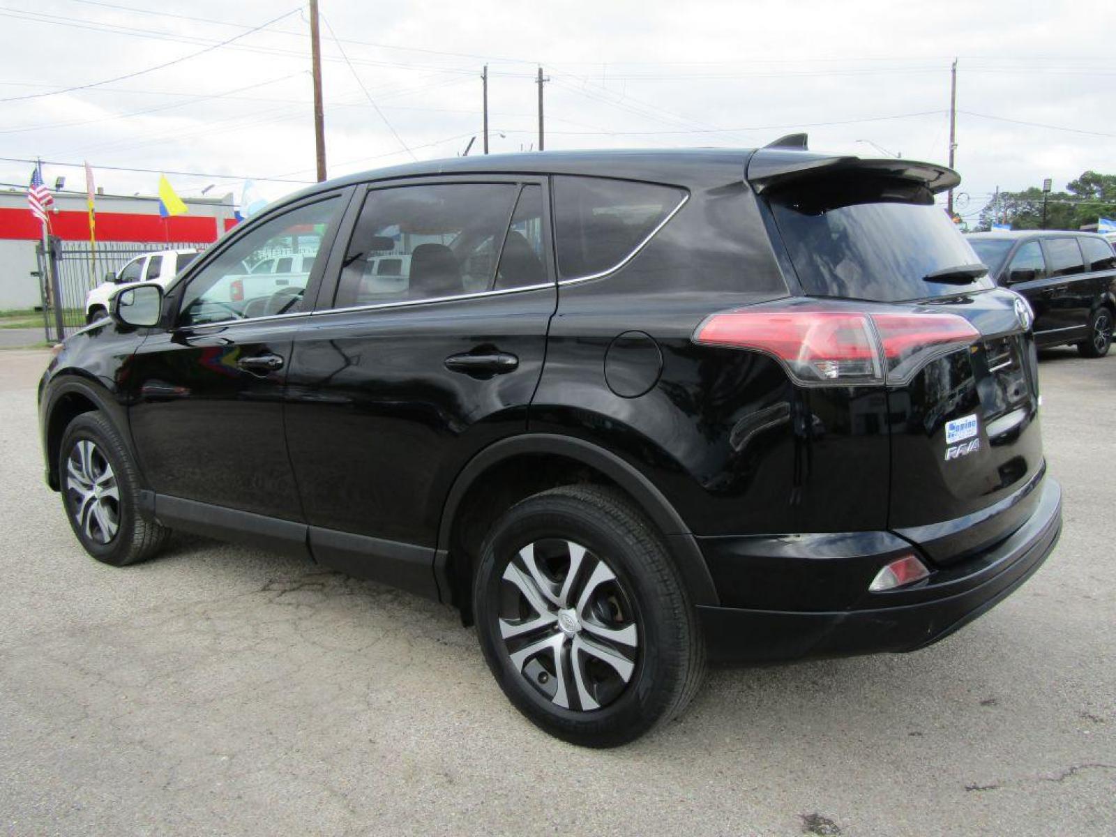 2017 BLACK TOYOTA RAV4 LE (2T3ZFREV5HW) with an 2.5L engine, Automatic transmission, located at 830 E. Canino Rd., Houston, TX, 77037, (281) 405-0440, 38.358219, -81.729942 - Photo #4