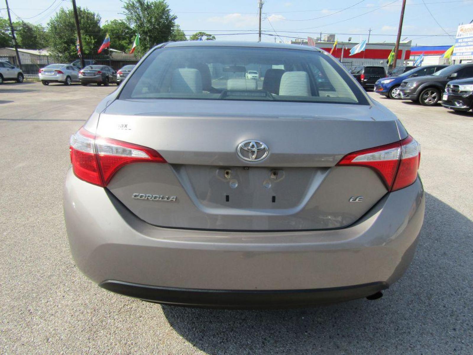2016 BROWN TOYOTA COROLLA L (2T1BURHE9GC) with an 1.8L engine, Automatic transmission, located at 830 E. Canino Rd., Houston, TX, 77037, (281) 405-0440, 38.358219, -81.729942 - Photo #3