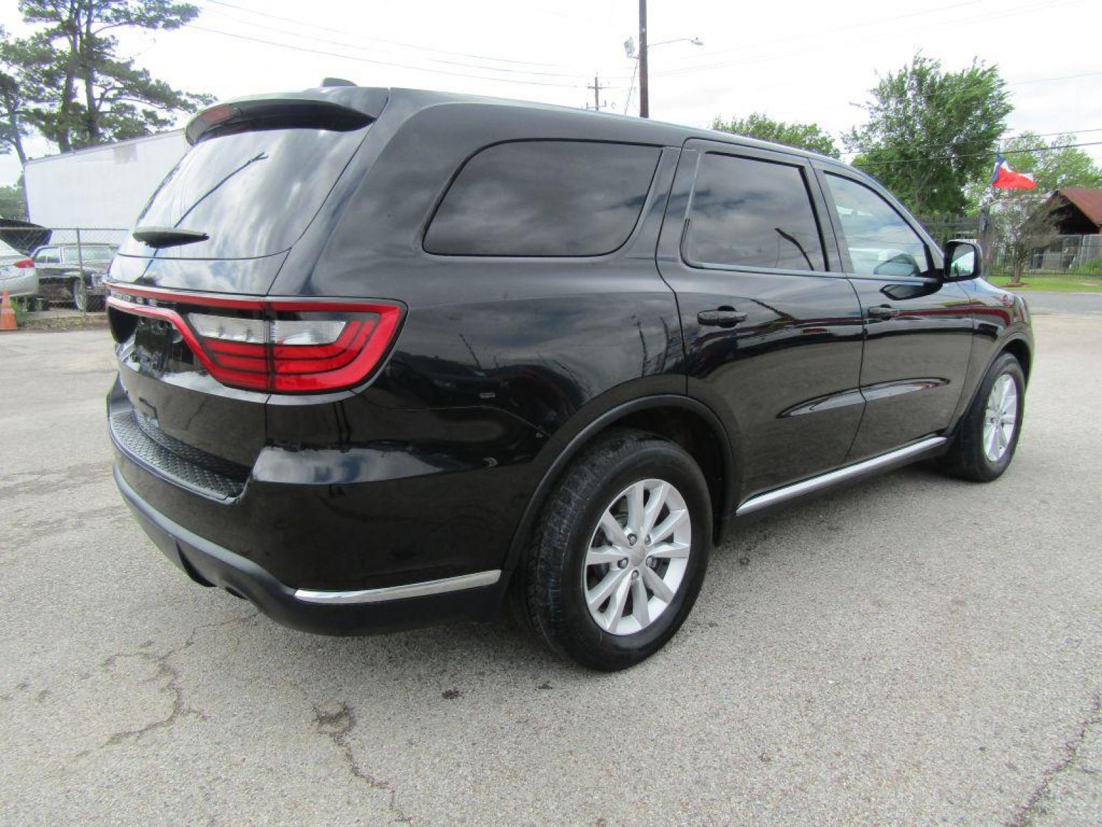 2015 BLACK DODGE DURANGO SXT (1C4RDHAG2FC) with an 3.6L engine, Automatic transmission, located at 830 E. Canino Rd., Houston, TX, 77037, (281) 405-0440, 38.358219, -81.729942 - Photo #4