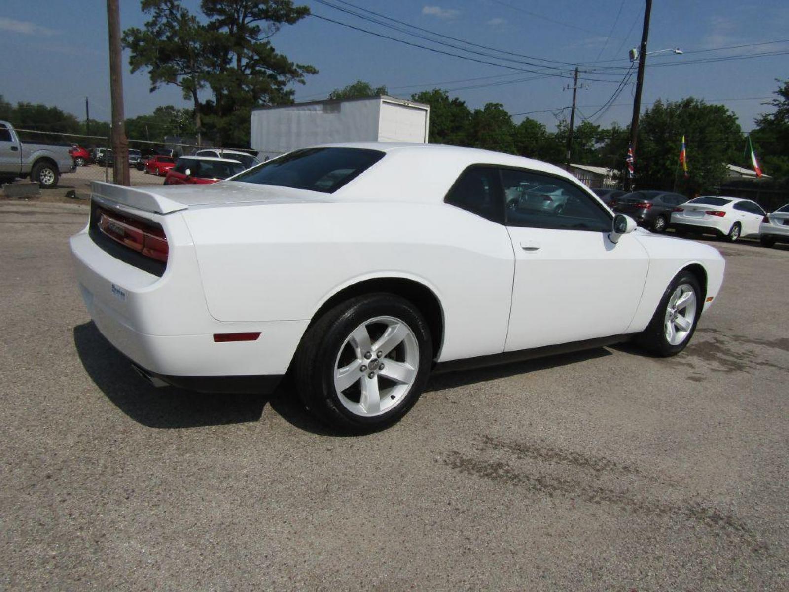 2014 WHITE DODGE CHALLENGER SXT (2C3CDYAG1EH) with an 3.6L engine, Automatic transmission, located at 830 E. Canino Rd., Houston, TX, 77037, (281) 405-0440, 38.358219, -81.729942 - Photo #2