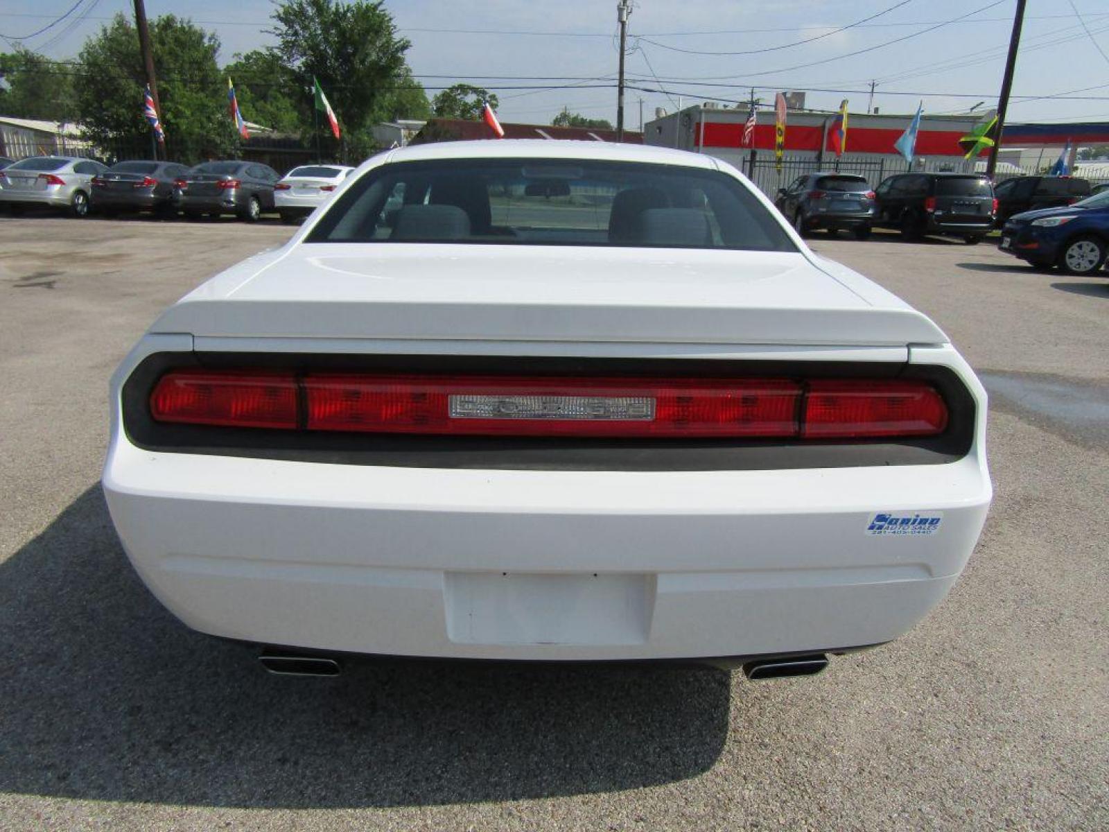 2014 WHITE DODGE CHALLENGER SXT (2C3CDYAG1EH) with an 3.6L engine, Automatic transmission, located at 830 E. Canino Rd., Houston, TX, 77037, (281) 405-0440, 38.358219, -81.729942 - Photo #3