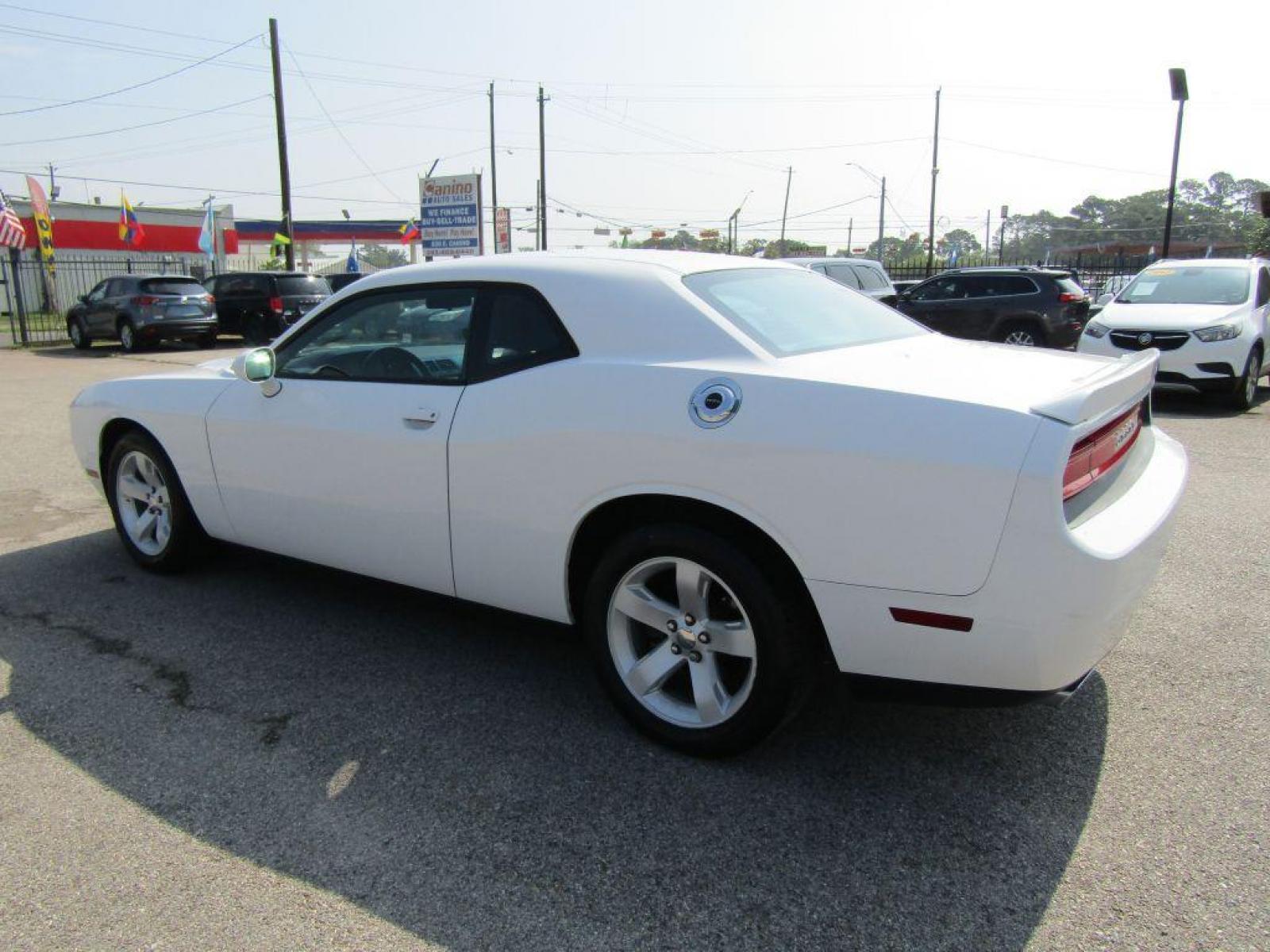 2014 WHITE DODGE CHALLENGER SXT (2C3CDYAG1EH) with an 3.6L engine, Automatic transmission, located at 830 E. Canino Rd., Houston, TX, 77037, (281) 405-0440, 38.358219, -81.729942 - Photo #4