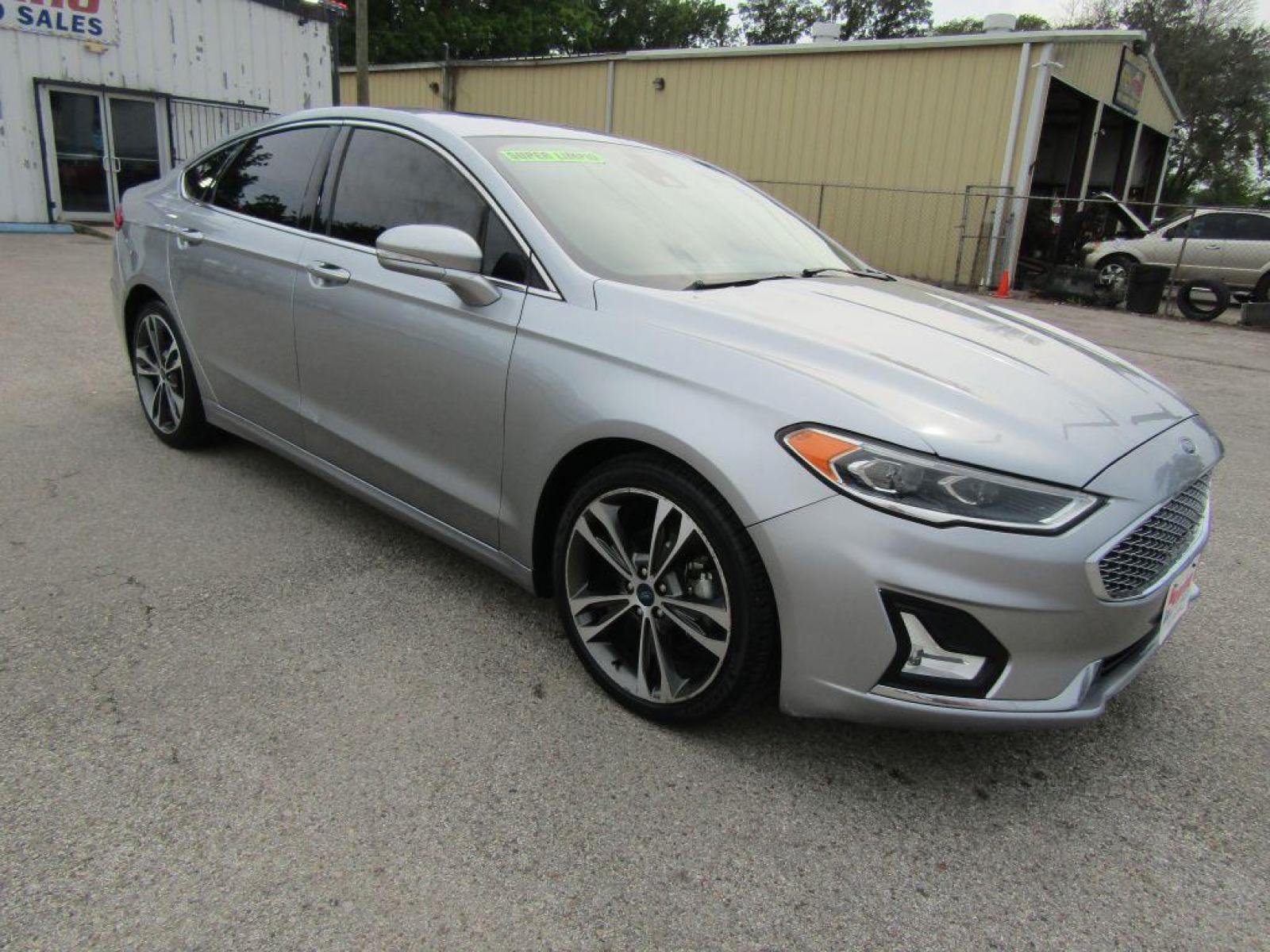 2020 SILVER FORD FUSION** TITANIUM (3FA6P0K9XLR) with an 2.0L engine, Automatic transmission, located at 830 E. Canino Rd., Houston, TX, 77037, (281) 405-0440, 38.358219, -81.729942 - Photo #1