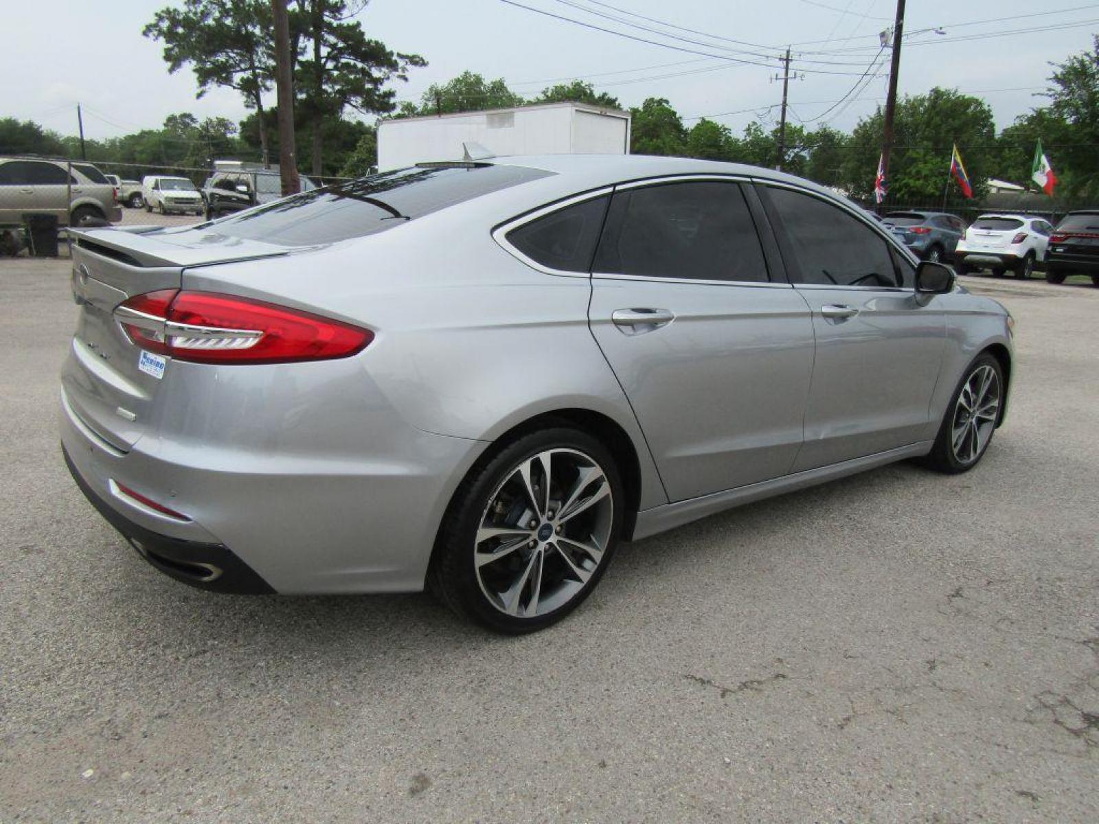 2020 SILVER FORD FUSION** TITANIUM (3FA6P0K9XLR) with an 2.0L engine, Automatic transmission, located at 830 E. Canino Rd., Houston, TX, 77037, (281) 405-0440, 38.358219, -81.729942 - Photo #2