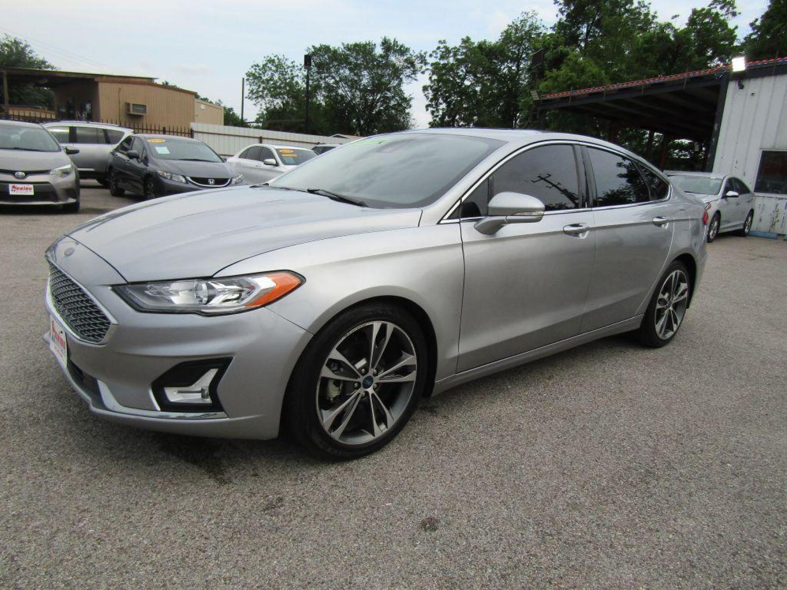 2020 SILVER FORD FUSION** TITANIUM (3FA6P0K9XLR) with an 2.0L engine, Automatic transmission, located at 830 E. Canino Rd., Houston, TX, 77037, (281) 405-0440, 38.358219, -81.729942 - Photo #5