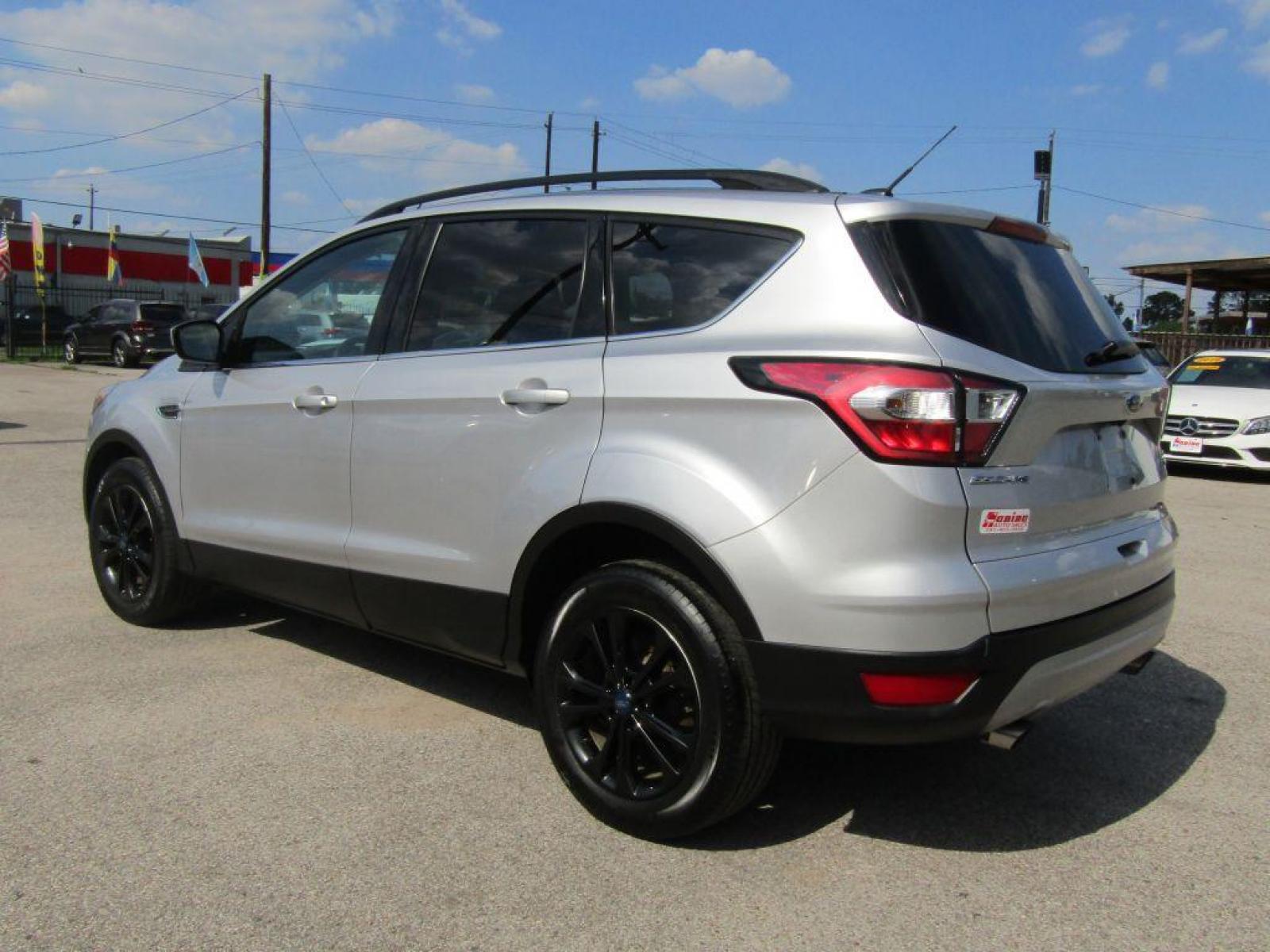 2017 SILVER FORD ESCAPE** SE (1FMCU0G97HU) with an 2.0L engine, Automatic transmission, located at 830 E. Canino Rd., Houston, TX, 77037, (281) 405-0440, 38.358219, -81.729942 - Photo #2