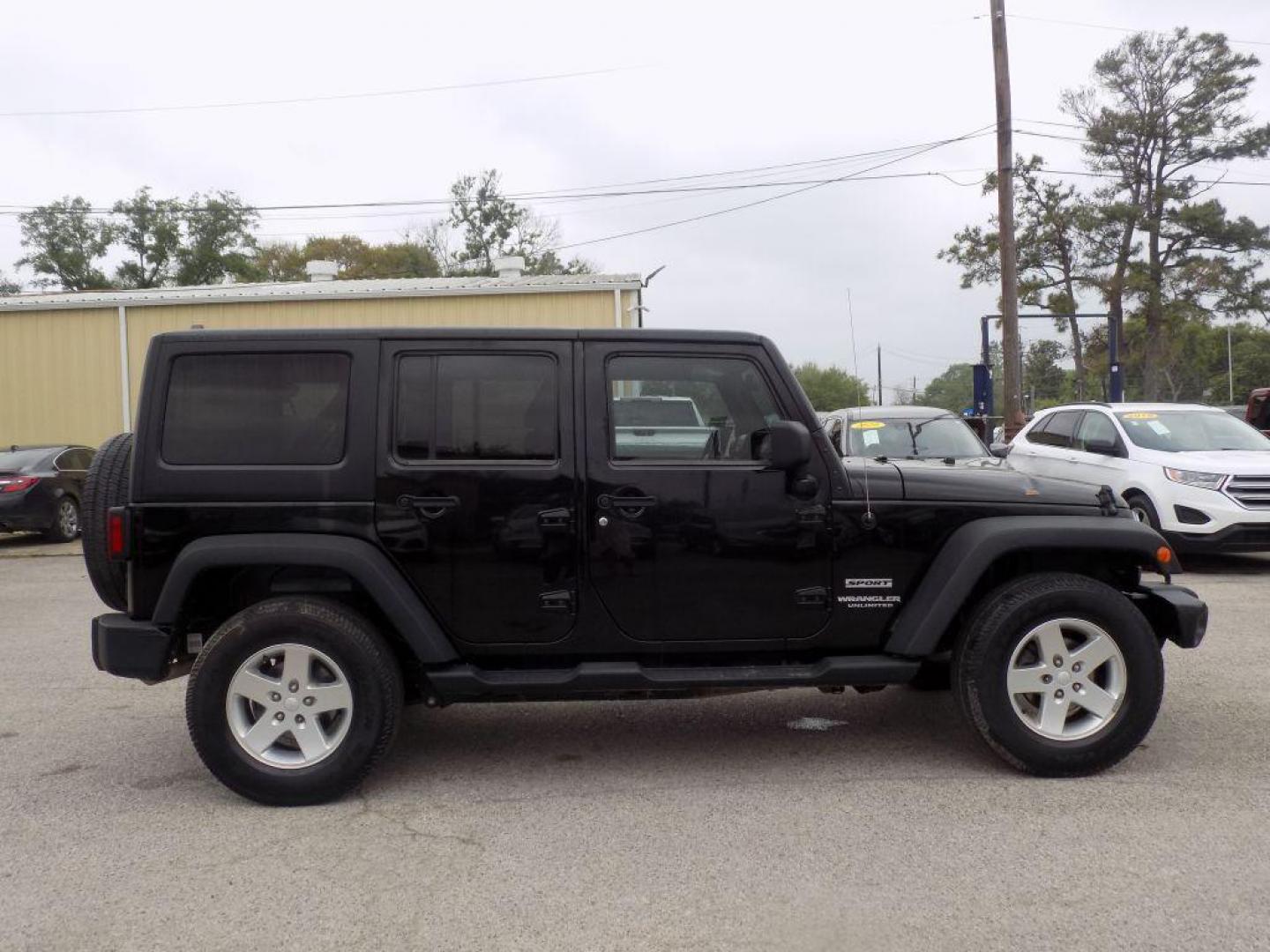 2013 BLACK JEEP WRANGLER UNLIMI SPORT (1C4BJWDG3DL) with an 3.6L engine, Automatic transmission, located at 830 E. Canino Rd., Houston, TX, 77037, (281) 405-0440, 38.358219, -81.729942 - Photo#1