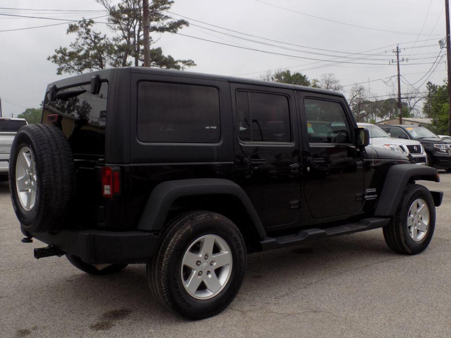 2013 BLACK JEEP WRANGLER UNLIMI SPORT (1C4BJWDG3DL) with an 3.6L engine, Automatic transmission, located at 830 E. Canino Rd., Houston, TX, 77037, (281) 405-0440, 38.358219, -81.729942 - Photo#2